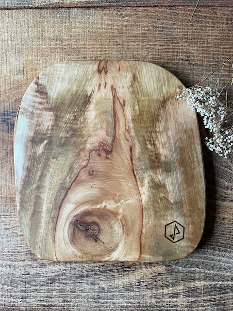 Serving board made from a fired wild chestnut tree